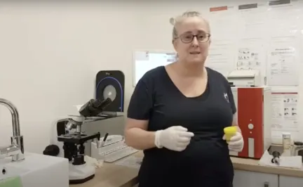 Mel testing a urine sample in the lab